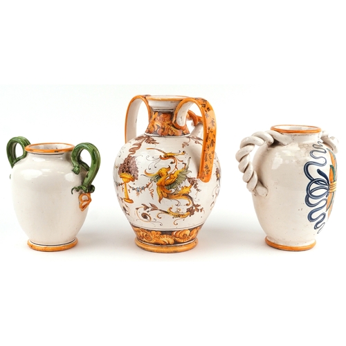 20 - Three Majolica apothecary jars, the largest 38cm high.