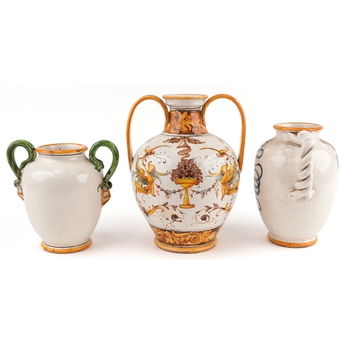 20 - Three Majolica apothecary jars, the largest 38cm high.