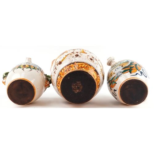 20 - Three Majolica apothecary jars, the largest 38cm high.