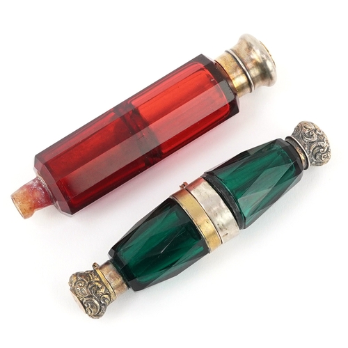 98 - Two Victorian double ended facetted glass scent bottles with white metal mounts, the largest 12cm in... 