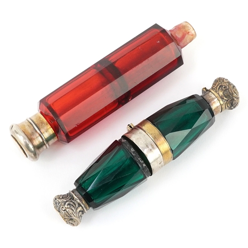 98 - Two Victorian double ended facetted glass scent bottles with white metal mounts, the largest 12cm in... 