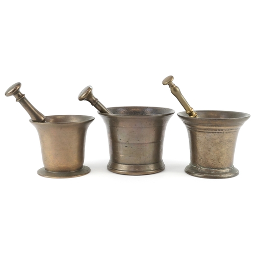  17th century and later bronze pestles and mortars, the largest pestle 21cm in length.