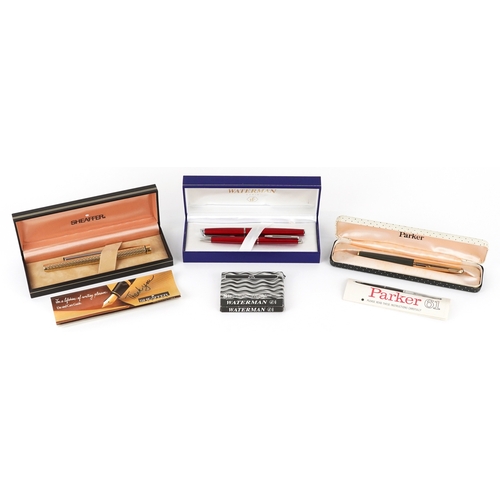 120 - A Sheaffer gold plated engine turned fountain pen with 14K gold nib, together with a Parker fountain... 