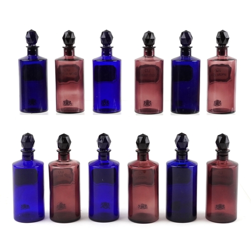 86 - A collection of Royal Pharmaceutical Society coloured glass chemist bottles with facetted stoppers, ... 
