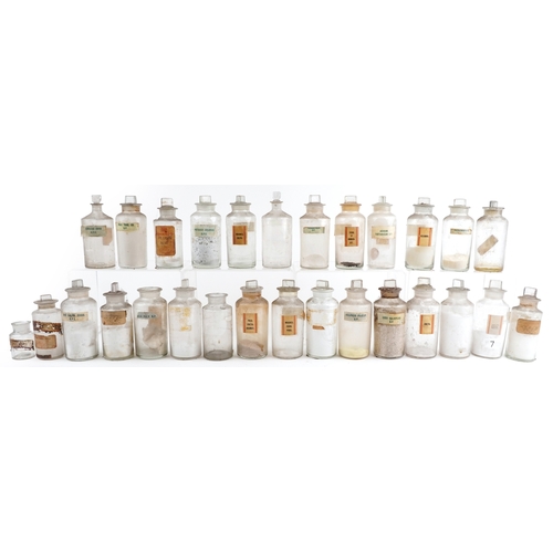 88 - A large collection of early 20th century pharmaceutical/apothecary glass jars, mostly with stoppers,... 