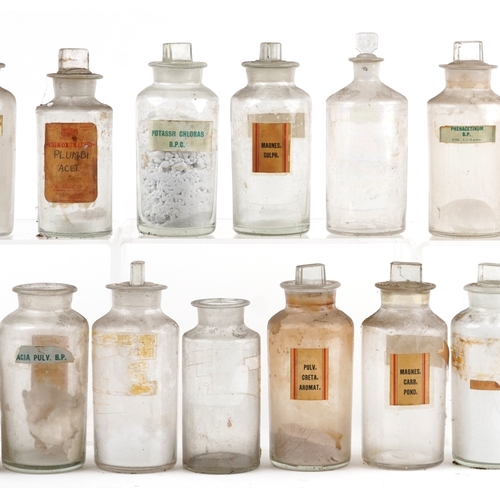 88 - A large collection of early 20th century pharmaceutical/apothecary glass jars, mostly with stoppers,... 