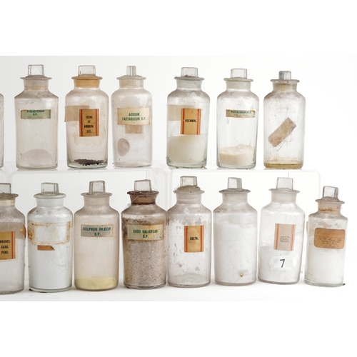 88 - A large collection of early 20th century pharmaceutical/apothecary glass jars, mostly with stoppers,... 
