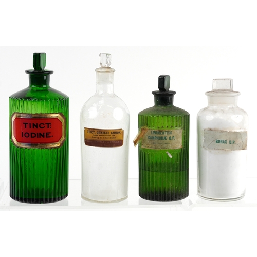 81 - A collection of early 20th century apothecary/pharmaceutical glass bottles with stoppers, the larges... 