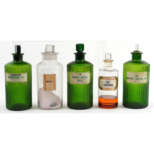 81 - A collection of early 20th century apothecary/pharmaceutical glass bottles with stoppers, the larges... 