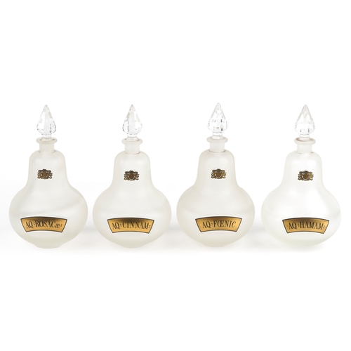 74 - A set of four Royal Pharmaceutical Society clear frosted glass apothecary bottles with cut glass sto... 