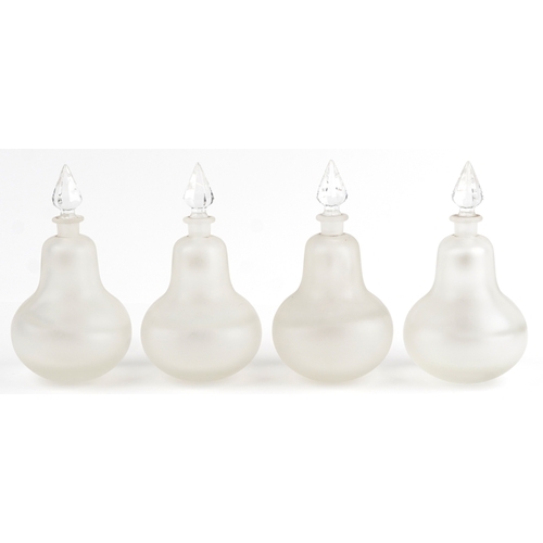 74 - A set of four Royal Pharmaceutical Society clear frosted glass apothecary bottles with cut glass sto... 
