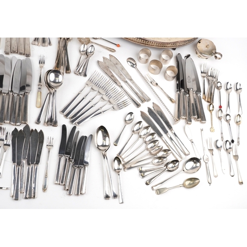 A large collection of silver plated cutlery and objects including ...