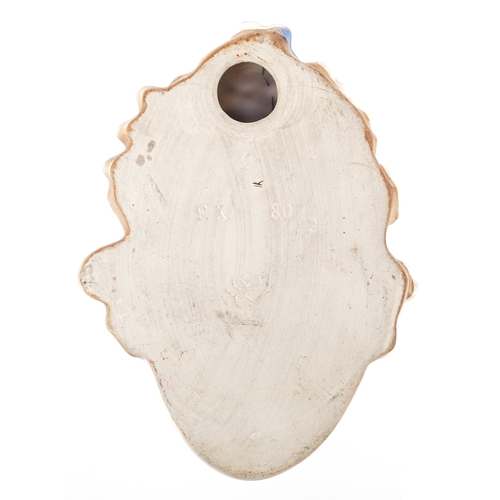  An Art Deco Goebel hand painted pottery wall mask, 17cm high.