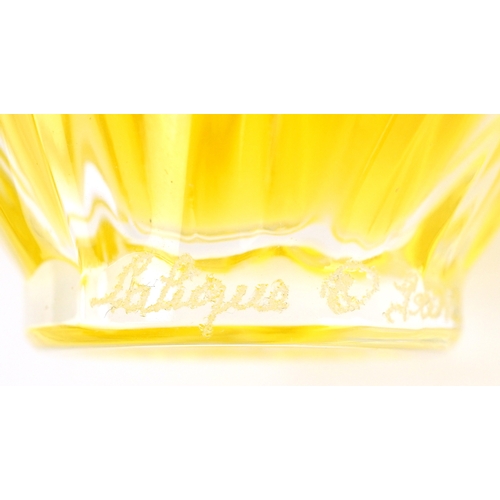 2 - Lalique for Nina Ricci, a signed moulded glass scent bottle with contents, etched Lalique France to ... 