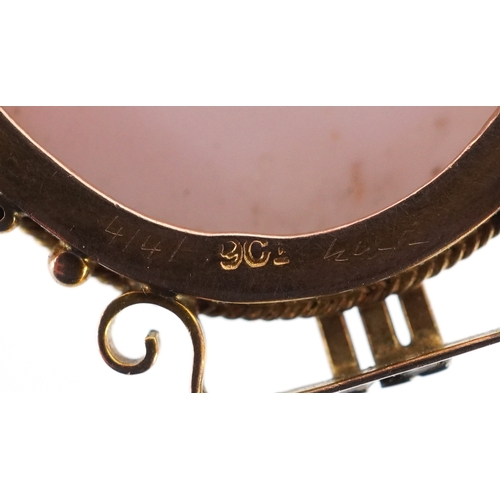  A 9ct gold mounted angel skin cameo brooch carved with a maiden, 3.7cm high, 9.1g.