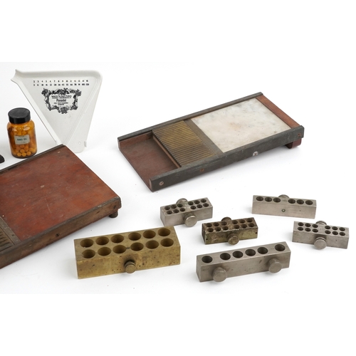 89 - A collection of late 19th century and later apothecary/pharmaceutical items including pill rolling e... 