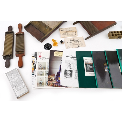 89 - A collection of late 19th century and later apothecary/pharmaceutical items including pill rolling e... 