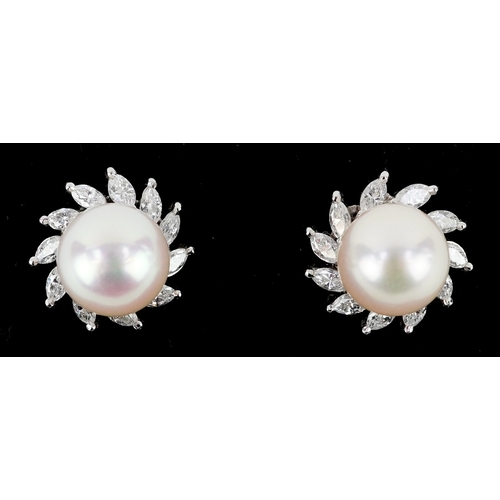  A 14K white gold cultured pearl and ruby ring with leaf design shoulders, size L, together with a pa... 