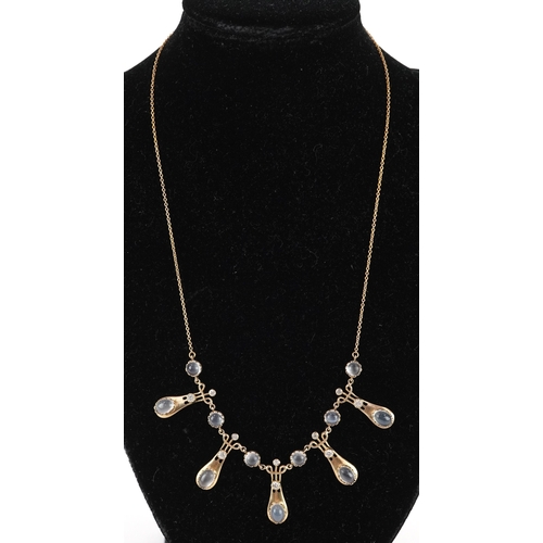  An Art Nouveau style 9ct gold diamond and moonstone fringe necklace, 44cm in length, 8.5g.