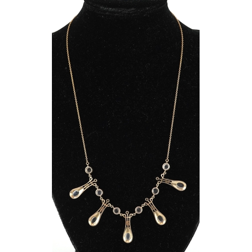  An Art Nouveau style 9ct gold diamond and moonstone fringe necklace, 44cm in length, 8.5g.
