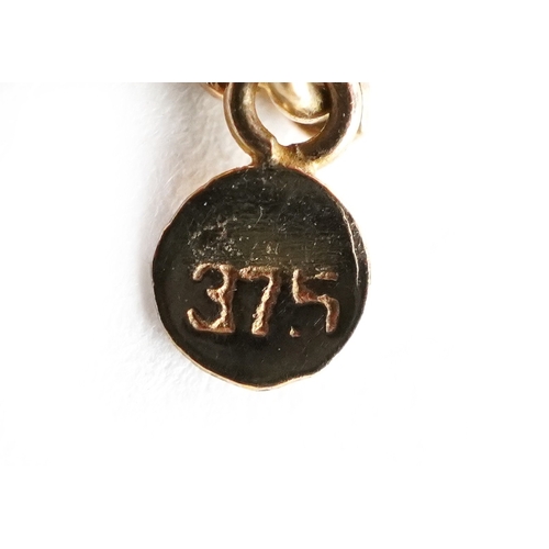  An Art Nouveau style 9ct gold diamond and moonstone fringe necklace, 44cm in length, 8.5g.