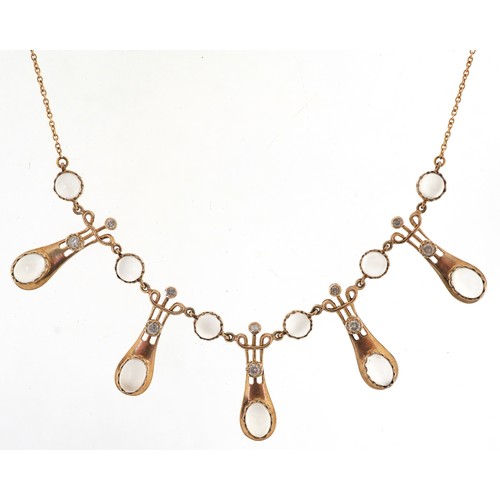  An Art Nouveau style 9ct gold diamond and moonstone fringe necklace, 44cm in length, 8.5g.