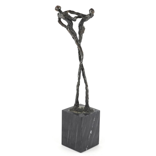 37 - A Corry Ammerlaan bronze figure group raised on a black granite base, 26cm high.