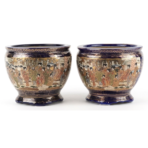 63 - A pair of Japanese Satsuma earthenware jardinières finely hand painted with panels of figures onto a... 