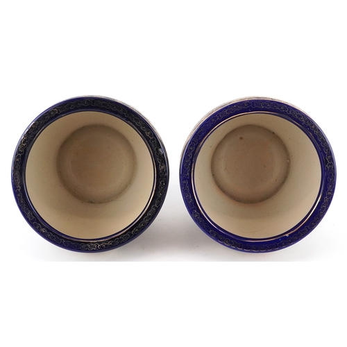 63 - A pair of Japanese Satsuma earthenware jardinières finely hand painted with panels of figures onto a... 