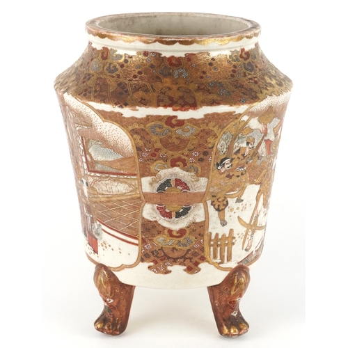 53 - A large Japanese Satsuma earthenware vase raised on three paw feet, finely hand painted with figures... 