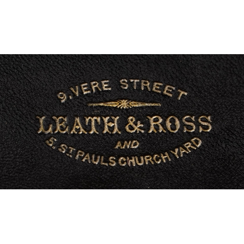 90 - A late George III mahogany apothecary cabinet housing a large collection of glass bottles with paper... 