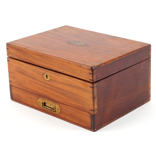 90 - A late George III mahogany apothecary cabinet housing a large collection of glass bottles with paper... 