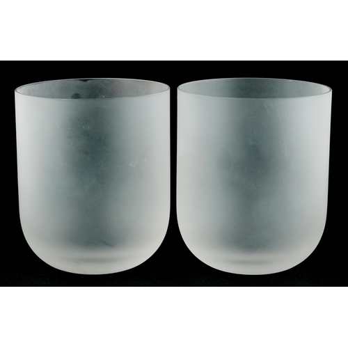 4 - Lalique, a pair of frosted glass bar tumblers, each etched Lalique France to the base, 10cm high.