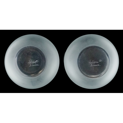4 - Lalique, a pair of frosted glass bar tumblers, each etched Lalique France to the base, 10cm high.