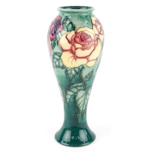 68 - Sally Tuffin, a Moorcroft pottery vase hand painted and tube lined in the Rose & Bud pattern, number... 