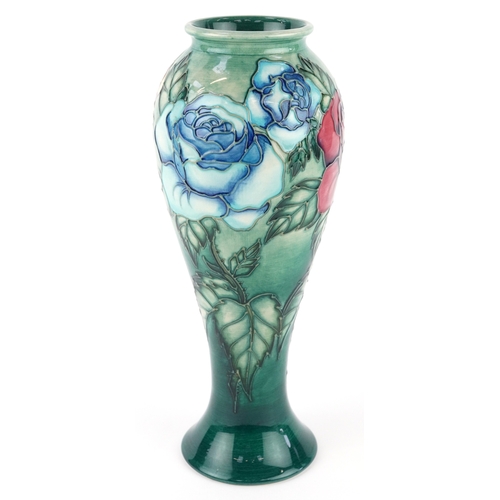 68 - Sally Tuffin, a Moorcroft pottery vase hand painted and tube lined in the Rose & Bud pattern, number... 