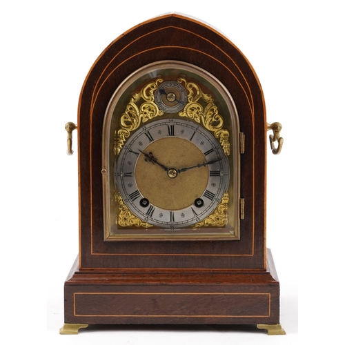 49 - An Edwardian inlaid mahogany dome top mantle clock having gilt dial and silvered chapter ring with R... 