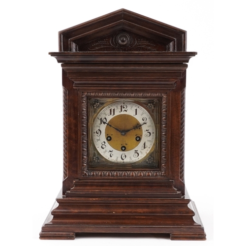 50 - Junghans, a mahogany cased mantle clock with Westminster chime having a silvered dial with Arabic nu... 
