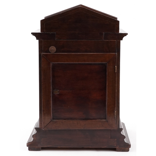 50 - Junghans, a mahogany cased mantle clock with Westminster chime having a silvered dial with Arabic nu... 