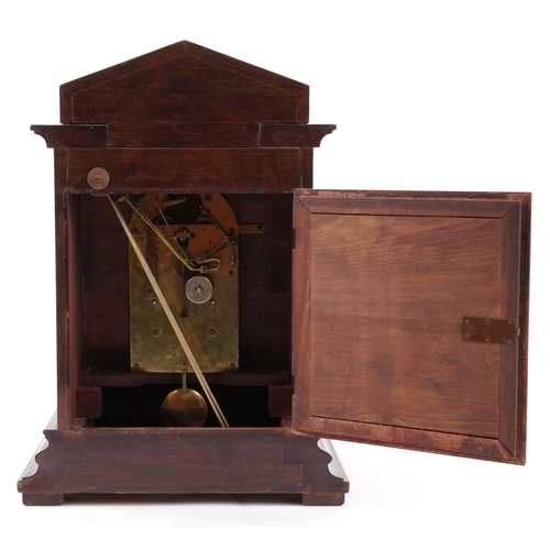 50 - Junghans, a mahogany cased mantle clock with Westminster chime having a silvered dial with Arabic nu... 