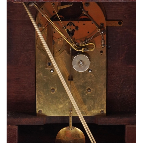 50 - Junghans, a mahogany cased mantle clock with Westminster chime having a silvered dial with Arabic nu... 