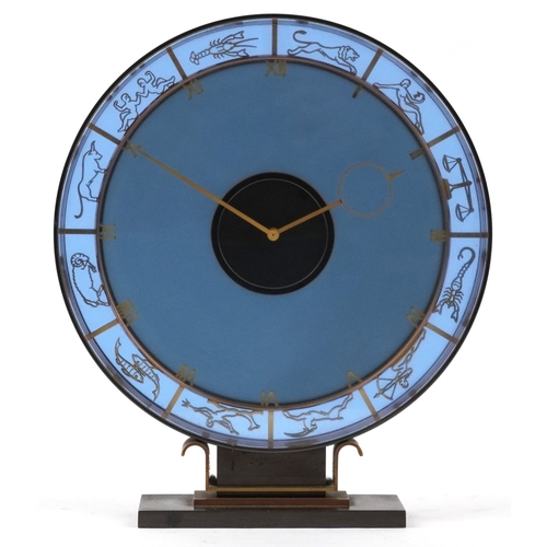 47 - Heinrich Möller for Kienzle, a blue glass zodiac mystery mantle clock, the brass frame pierced with ... 