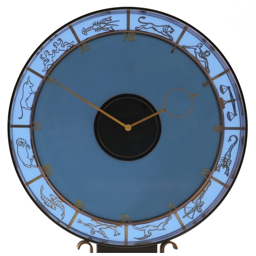 47 - Heinrich Möller for Kienzle, a blue glass zodiac mystery mantle clock, the brass frame pierced with ... 