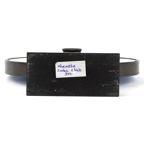 47 - Heinrich Möller for Kienzle, a blue glass zodiac mystery mantle clock, the brass frame pierced with ... 