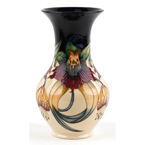 65 - Nicola Slaney for Moorcroft, a pottery vase hand painted and tube lined in the Anna Lily pattern, 33... 