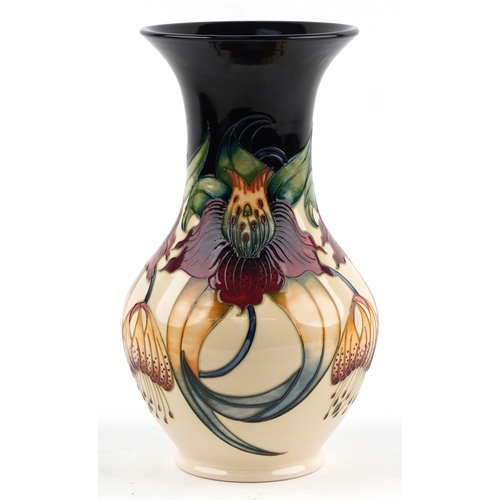65 - Nicola Slaney for Moorcroft, a pottery vase hand painted and tube lined in the Anna Lily pattern, 33... 