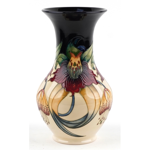 65 - Nicola Slaney for Moorcroft, a pottery vase hand painted and tube lined in the Anna Lily pattern, 33... 