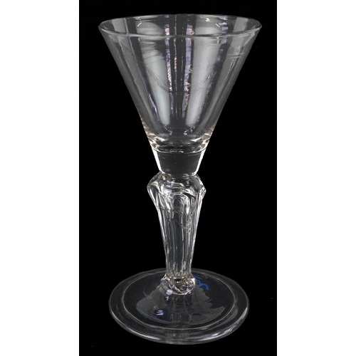 91 - An early 18th century wine glass with facetted stem, 15cm high.