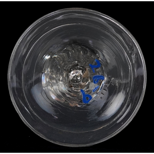 91 - An early 18th century wine glass with facetted stem, 15cm high.