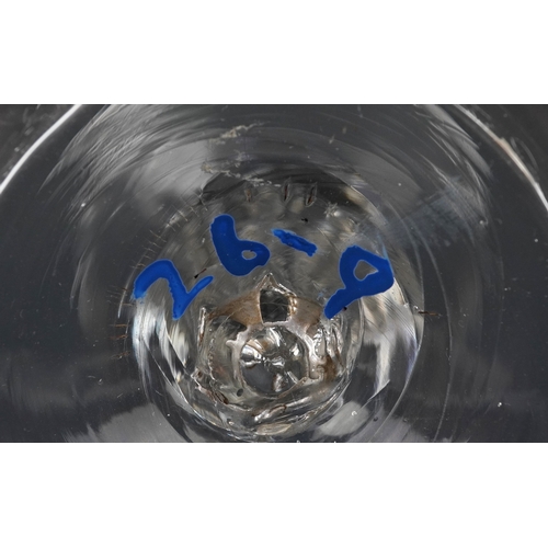 91 - An early 18th century wine glass with facetted stem, 15cm high.